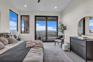 Bedroom featuring access to exterior, carpet flooring, a ceiling fan, a mountain view, and recessed lighting