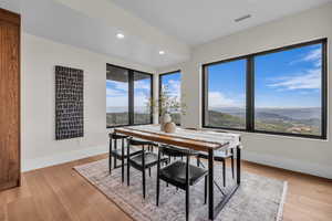 Dining room featuring recessed lighting, a mountain view, and light wood-type flooring