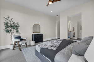 Bedroom with a ceiling fan, recessed lighting, carpet floors, and ensuite bath