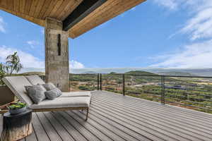Deck featuring a mountain view and a patio area