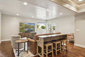 Bar featuring recessed lighting, dark wood finished floors, and french doors
