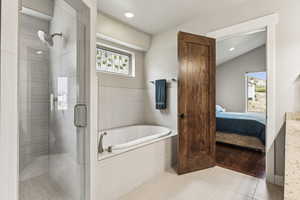 Ensuite bathroom with a shower stall, a garden tub, tile patterned floors, and recessed lighting