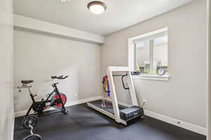 Exercise area featuring baseboards