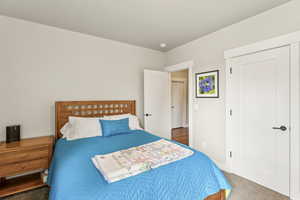 Bedroom with carpet flooring and baseboards