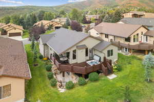 Aerial perspective of suburban area featuring a mountainous background