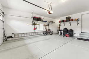 Garage featuring a garage door opener