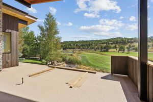 View of patio featuring view of golf course