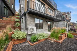 Landscaping around the patio makes it feel green and lush.