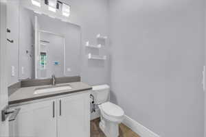 Bathroom with vanity and light tile patterned flooring