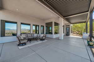 View of patio / terrace with outdoor lounge area and a mountain view
