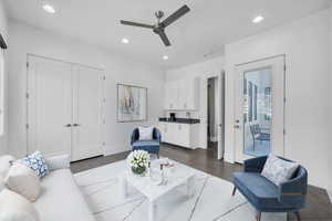 Living room with recessed lighting, a ceiling fan, and dark tile patterned floors
