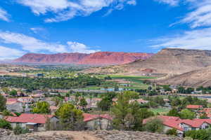 Mountain view with a large body of water and nearby suburban area