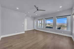 Empty room featuring recessed lighting, a ceiling fan, and light wood-style flooring