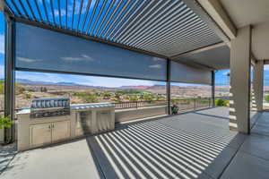 View of patio / terrace featuring a mountain view and area for grilling
