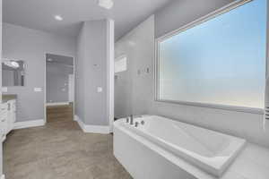 Full bath with vanity, a bath, a marble finish shower, and recessed lighting