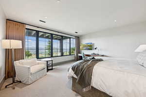 Bedroom with carpet floors and recessed lighting