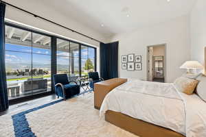 Bedroom featuring access to outside and wood finished floors
