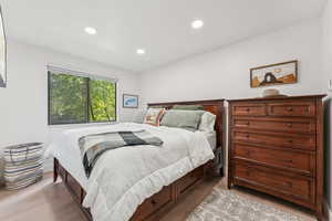 Bedroom with recessed lighting and light wood-style flooring