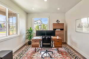 Office space featuring recessed lighting, wood finished floors, and a textured ceiling