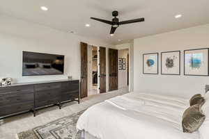 Carpeted bedroom featuring recessed lighting and a ceiling fan