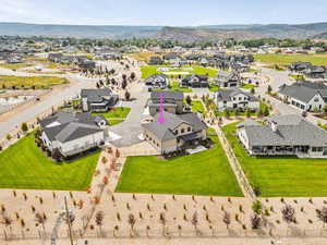 Aerial perspective of suburban area featuring a mountainous background