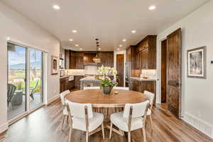 Dining area with light wood-type flooring, recessed lighting, and a mountain view