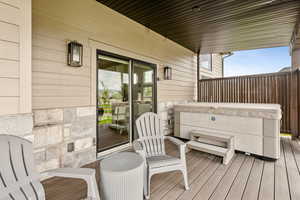 Wooden deck with a hot tub