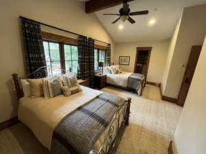 Bedroom with recessed lighting, beamed ceiling, a ceiling fan, light colored carpet, and high vaulted ceiling