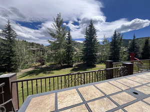 View of patio with a view of trees