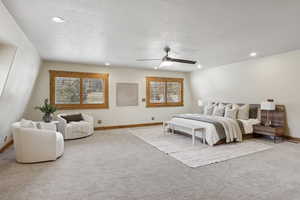 Bedroom with carpet flooring, a ceiling fan, recessed lighting, and a textured ceiling