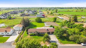 Overview of rural landscape featuring nearby suburban area