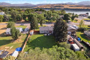 Aerial perspective of suburban area with a mountainous background