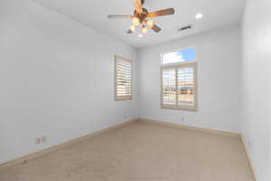 Carpeted empty room with recessed lighting and ceiling fan