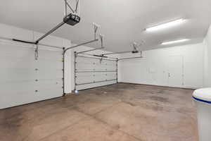 Garage featuring a garage door opener