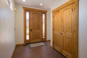 Entryway featuring recessed lighting and concrete floors