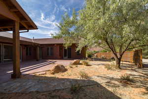 Back of property featuring a patio area and a metal roof