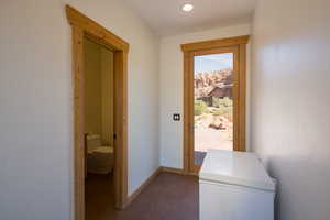 Hallway featuring baseboards and recessed lighting