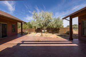 Fenced backyard featuring a patio