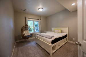 Carpeted bedroom with baseboards