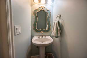 Bathroom featuring a textured wall