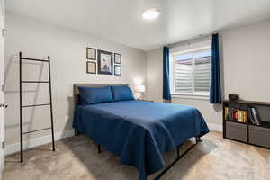 Bedroom with light carpet