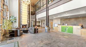 Welcome area featuring a high ceiling and a high end fireplace