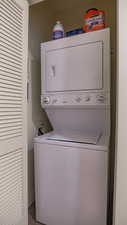 Laundry room featuring stacked washer / drying machine