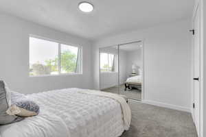 Bedroom with carpet flooring and a closet