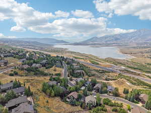Aerial perspective of suburban area with a water and mountain view