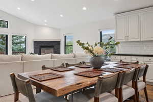 Dining space with recessed lighting, a fireplace, and healthy amount of natural light