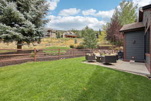 View of yard with outdoor lounge area and a patio area