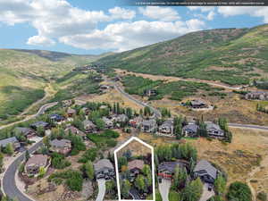 View of property location featuring nearby suburban area, property parcel outlined, and mountains