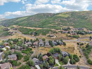 View of property location featuring nearby suburban area and mountains