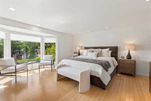 Bedroom with recessed lighting and light wood-style flooring